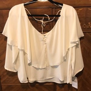 Flowy, white Zara shirt.